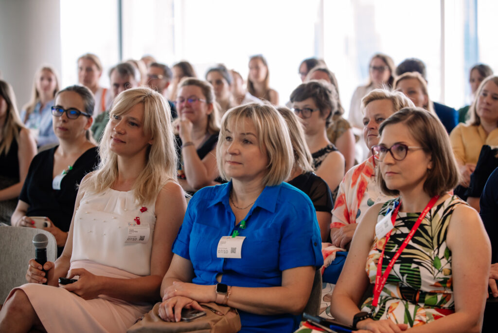 group of people sitting in a conference room; members of Be Internet Awesome program